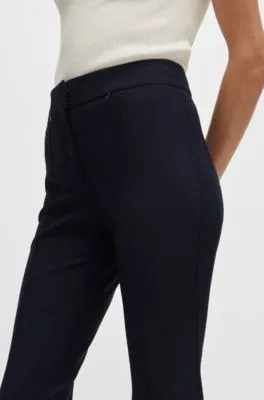 Pantalones extra slim fit en paño elástico de secado rápido