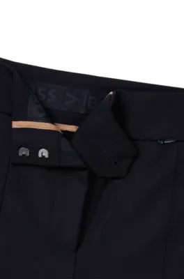 Pantalones extra slim fit en paño elástico de secado rápido